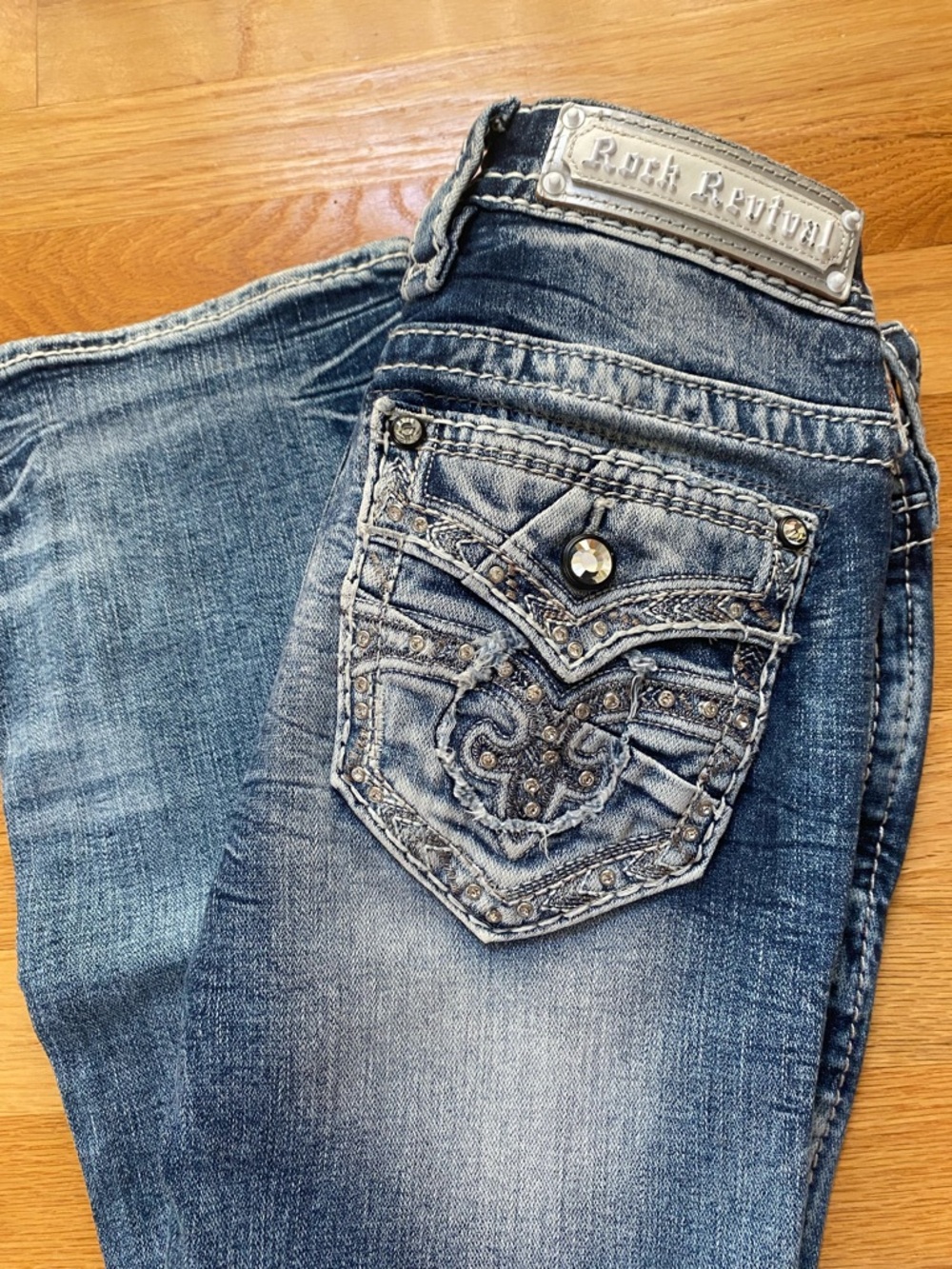 NWOT Rock Revival Women's Distressed Blue Boot Cut Jeans with Embellished Pocket